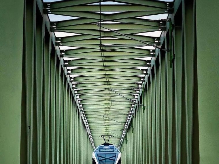Steel railway bridge with train