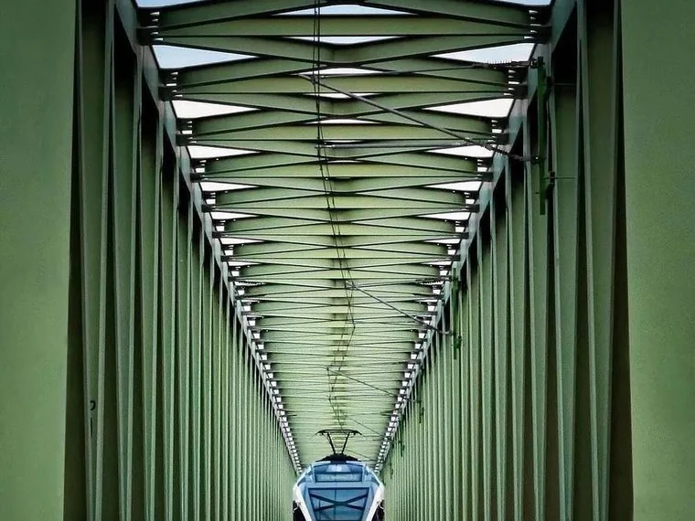 Steel railway bridge with train